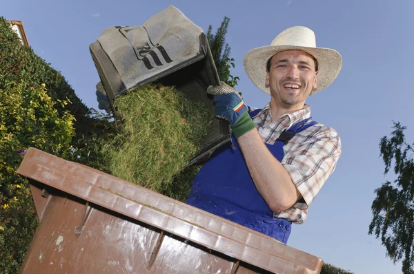 Man in the garden, compost bin