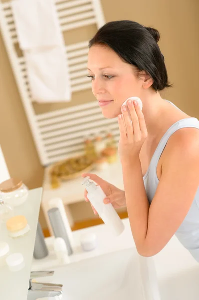 Young woman bathroom clean face make-up removal
