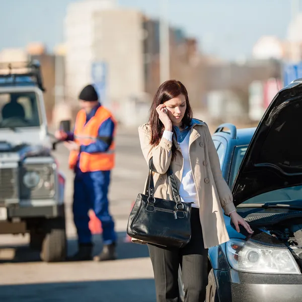 Woman on the phone after car crash