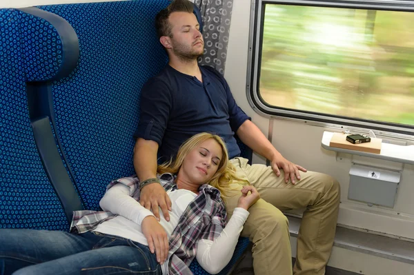 Couple sleeping in train woman man vacation