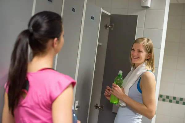 Woman with friend in changing room