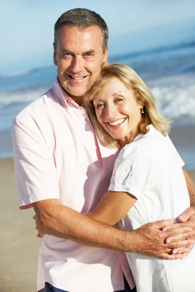 Senior Couple Enjoying Romantic Beach Holiday