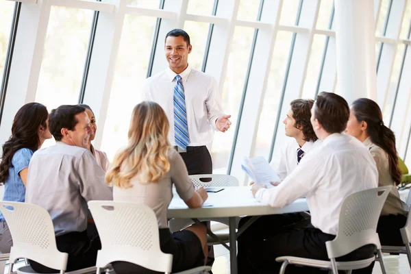 Business Having Board Meeting In Modern Office