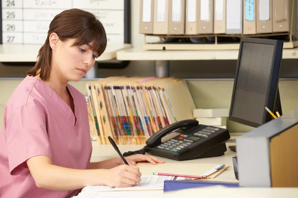 Nurse Working At Nurses Station