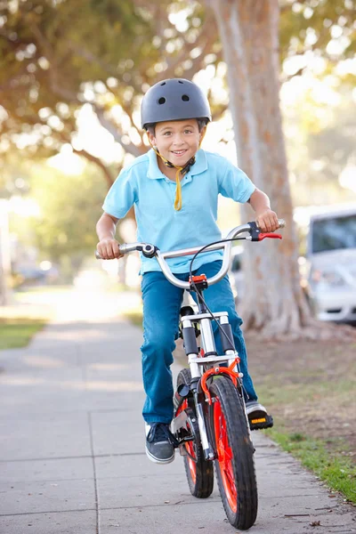 Boy Wearing Safety Helmet Riding Bike