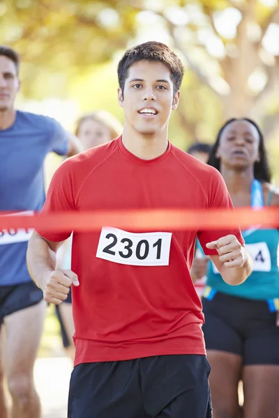 Male Runner Winning Marathon