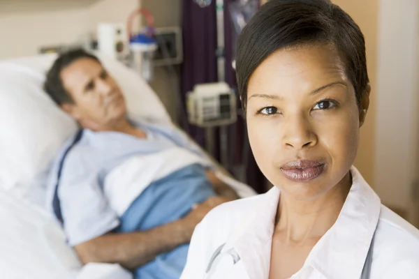 Doctor Looking Serious,Standing In Hospital Room