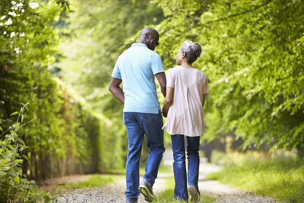 Couple Walking In Countryside