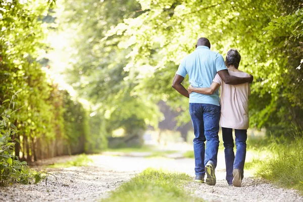 Couple Walking In Countryside