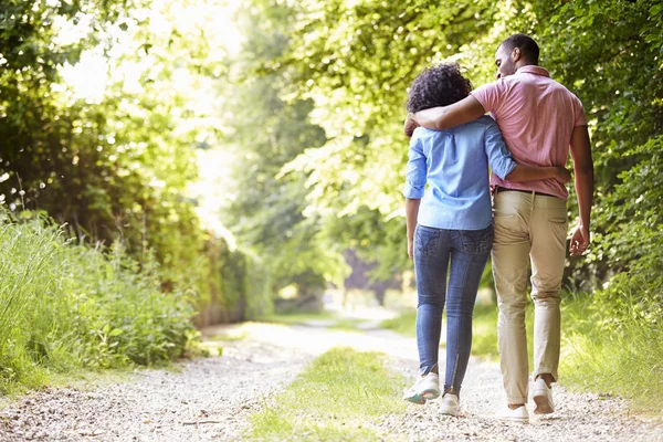 Couple Walking In Countryside