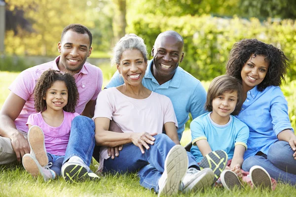 Family Sitting In Garden