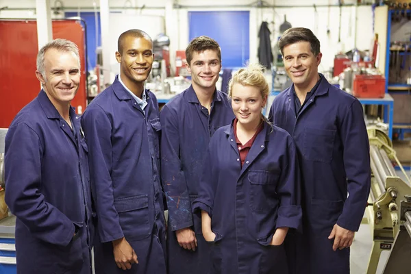 Staff Standing In Engineering Factory