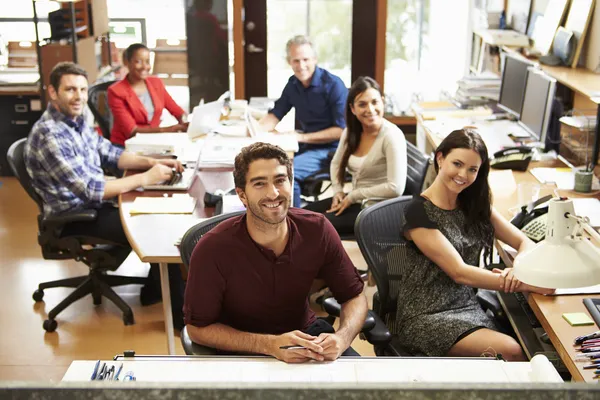 Portrait Of Office Staff At Table In Architect\'s Office