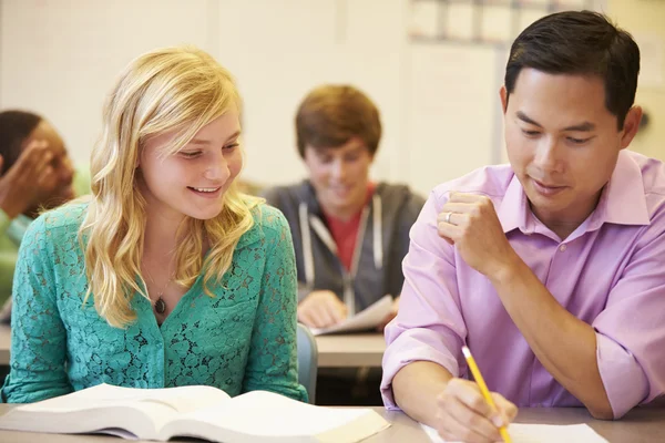 High School Teacher Helping Student