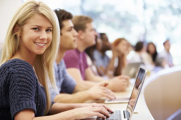 Class Of University Students Using Laptops In Lecture