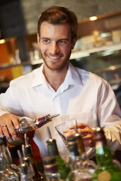 Barman Serving Drinks