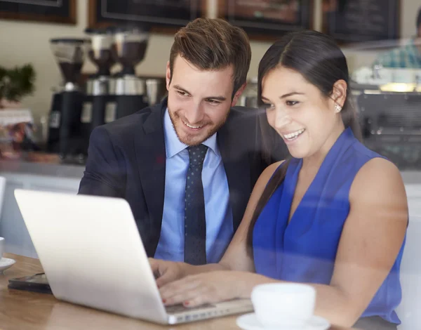 Businessman And Businesswoman Meeting In Coffee Shop