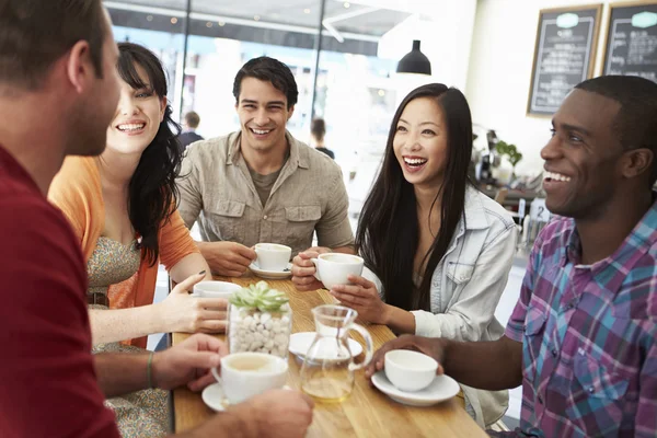 Group Of Friends Meeting In Coffee Shop