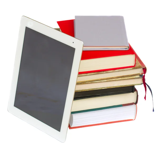 Pile of books with modern tablet PC