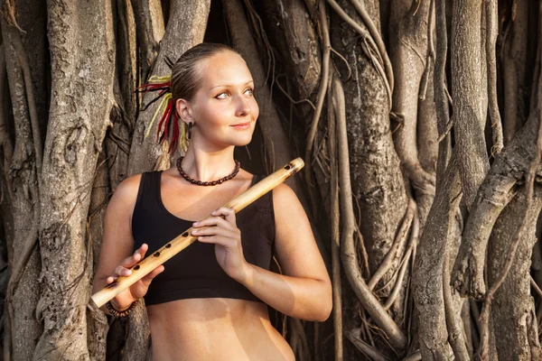 Woman with bamboo flute