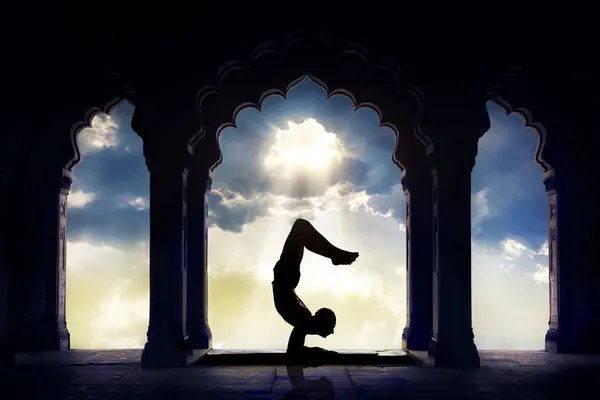 Yoga silhouette in temple