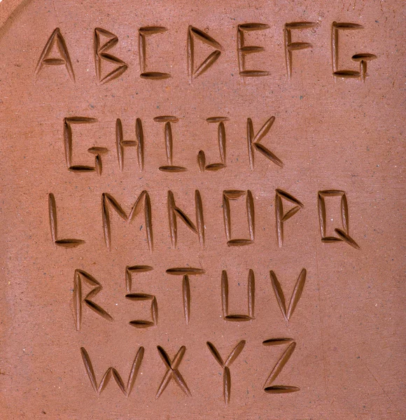Letters carved on clay