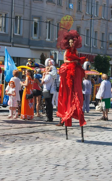 Girl dancing on the street at the city festival