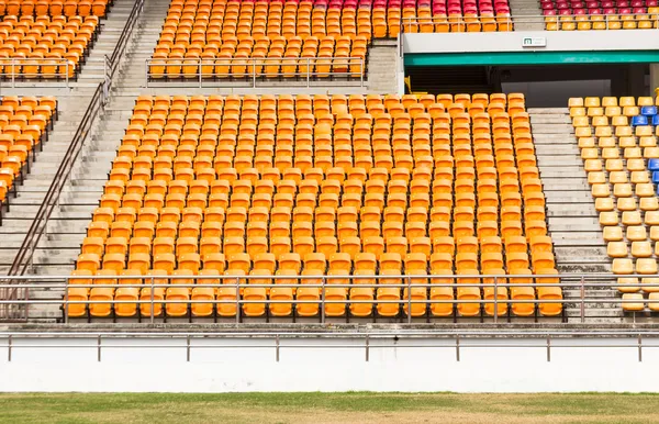 Rows of empty plastic stadium seats