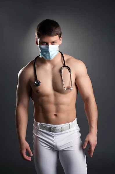 Sexy dancer in doctor costume with stethoscope