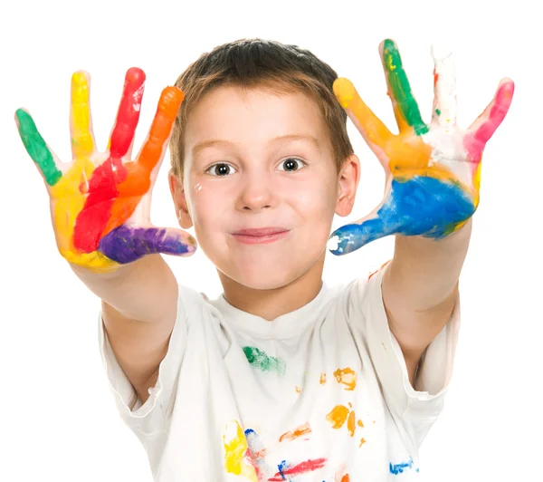 Boy shows his hands painted with paint