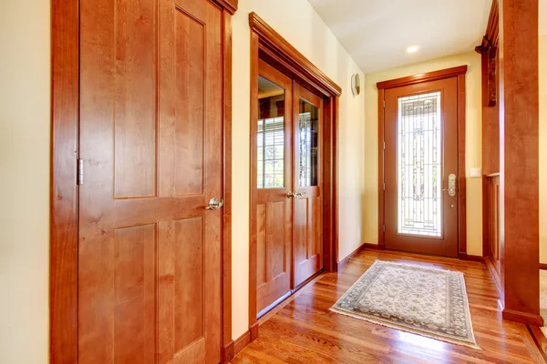 Luxury hallway and house entrance with cherry wood.