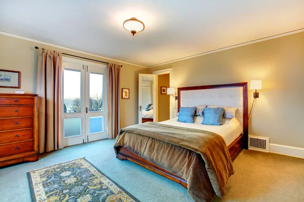 Elegant warm colors furnished bedroom