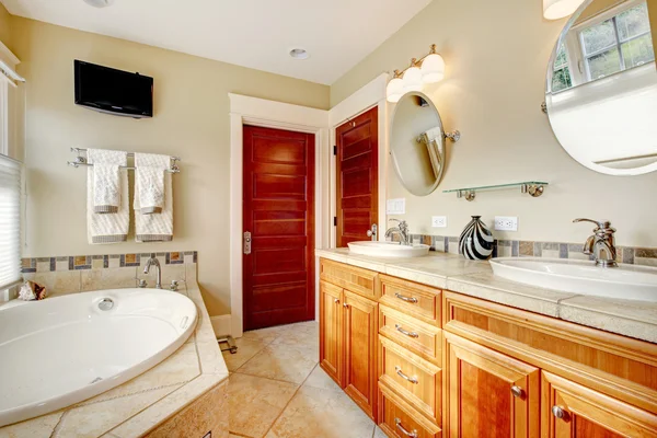 Modern bathroom with whirpool and tv