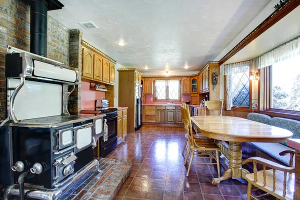 Impressive farmhouse kitchen room with antique stove