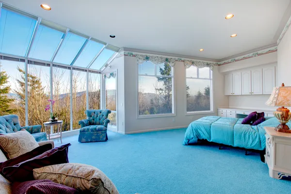 Amazing light blue and white bedroom with glass wall