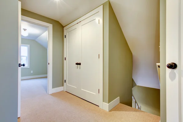 Bright hallway with built-in small storage room