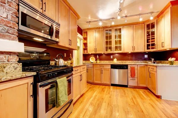 Bright kitchen room with brick designed wall