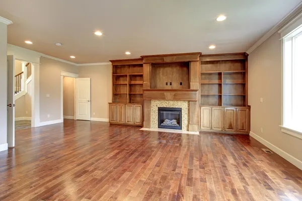 Brigh living room with fireplace and storage combination