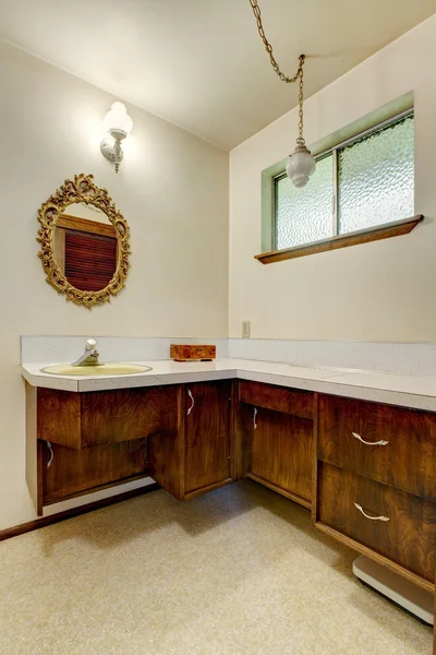 View of old wooden cabinets and antique mirror