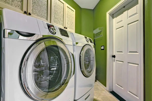 Bright green laundry room interior