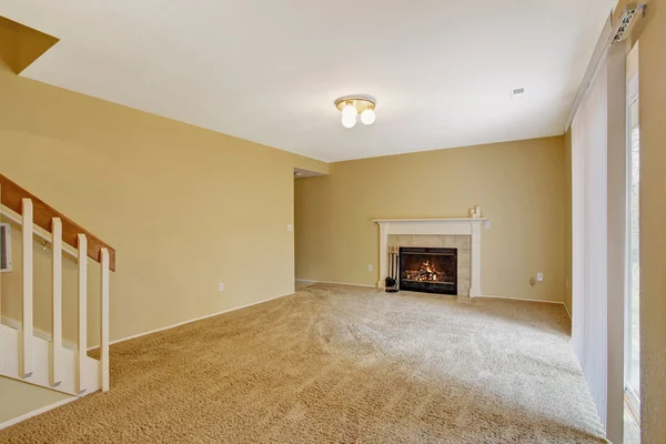 Empty house interior. Living room with fireplace