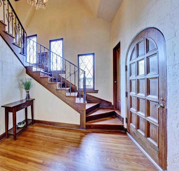 Luxury house interior. Entrance hallway with staircase