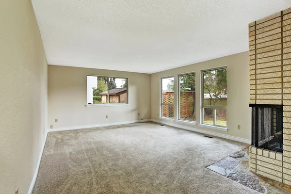 Empty bright living room with fireplace
