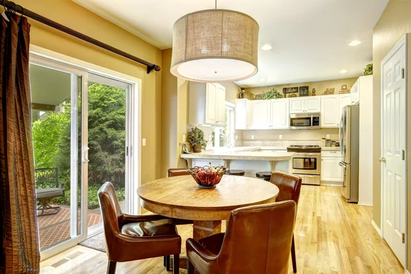 White kitchen room interior with dining area