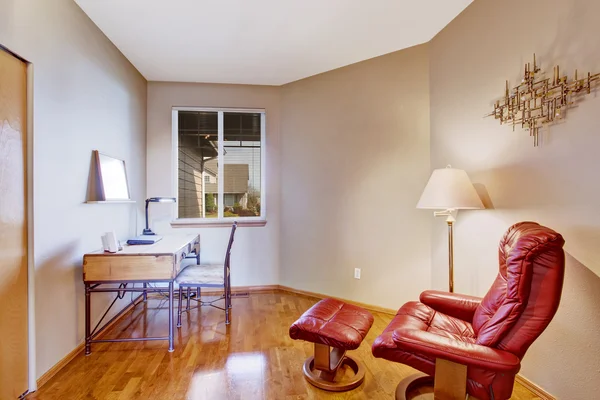 Office room with red comfortable chair for rest