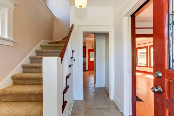 Hallway in empty house with staircase