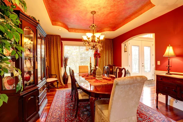 Luxury dining room in bright red colors