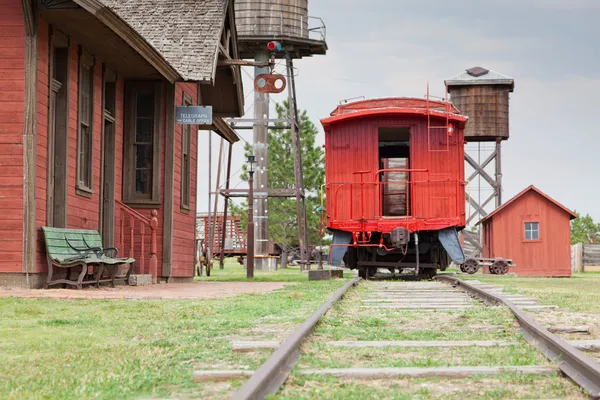 Red Caboose at Station