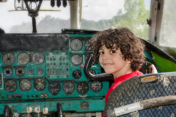 Child Playing Inside an Old Plane Cabin