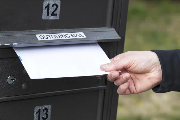 Putting Letter in Outgoing Postal Mailbox